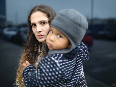 A woman holding a child